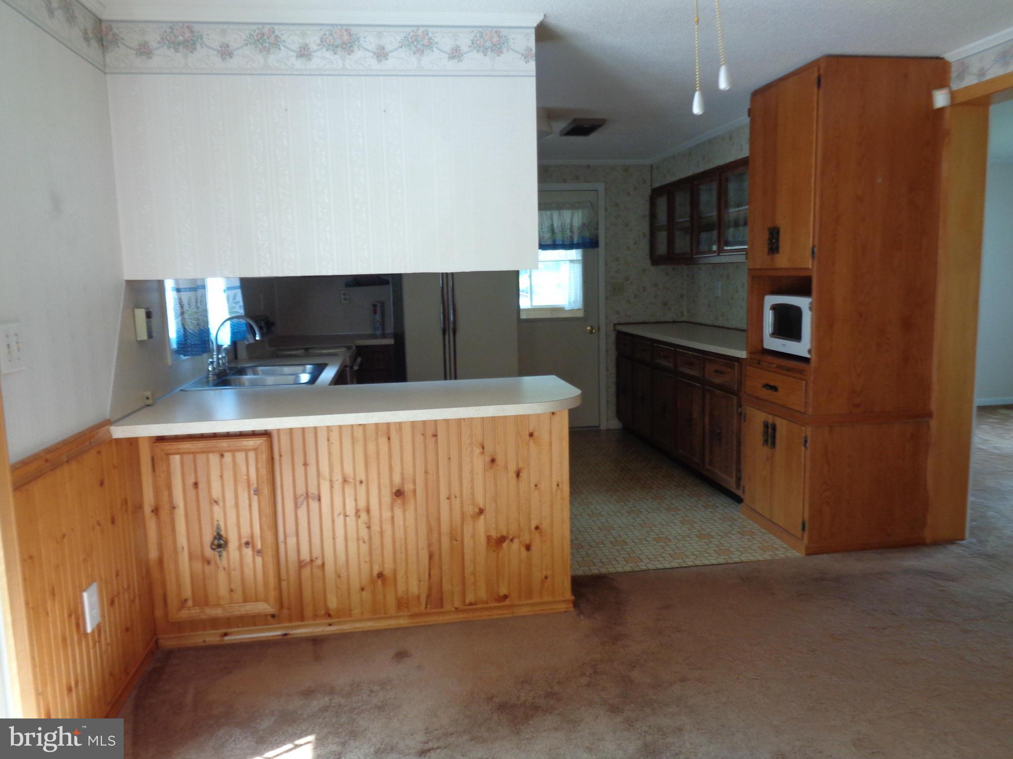 4307 York Road, Unit 1 Manchester, MD 21102 - Photo 18 of 30 a kitchen with stainless steel appliances a refrigerator and a stove
