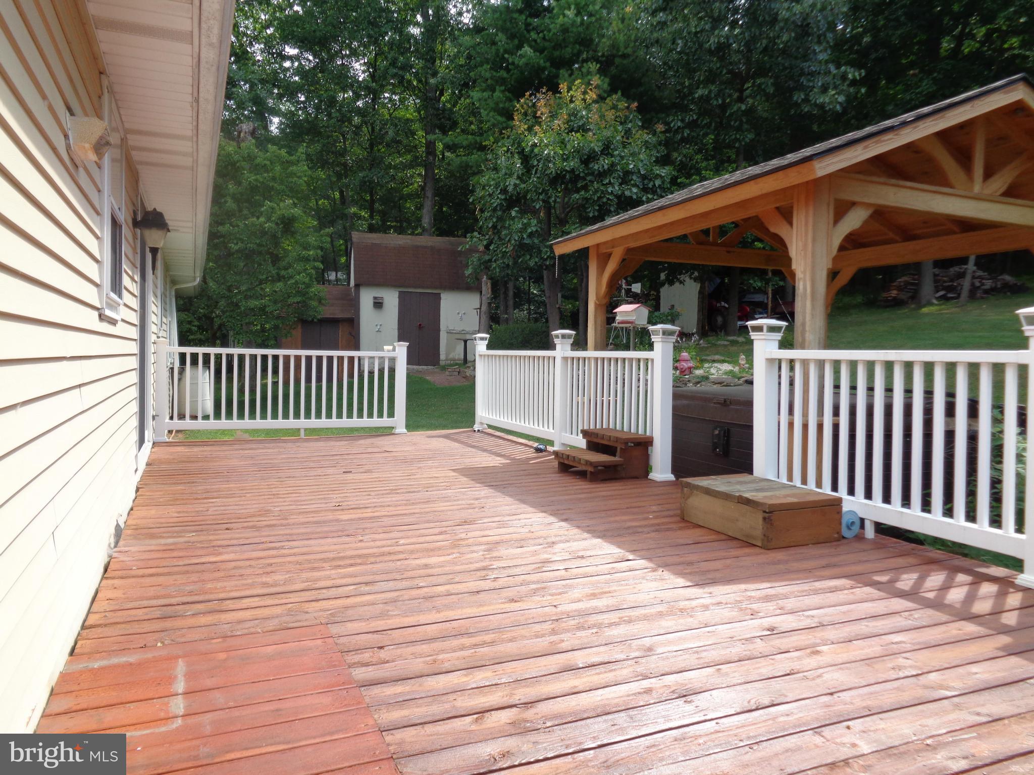 4307 York Road, Unit 1 Manchester, MD 21102 - Photo 3 of 30 a backyard of a house with wooden floor table and chairs