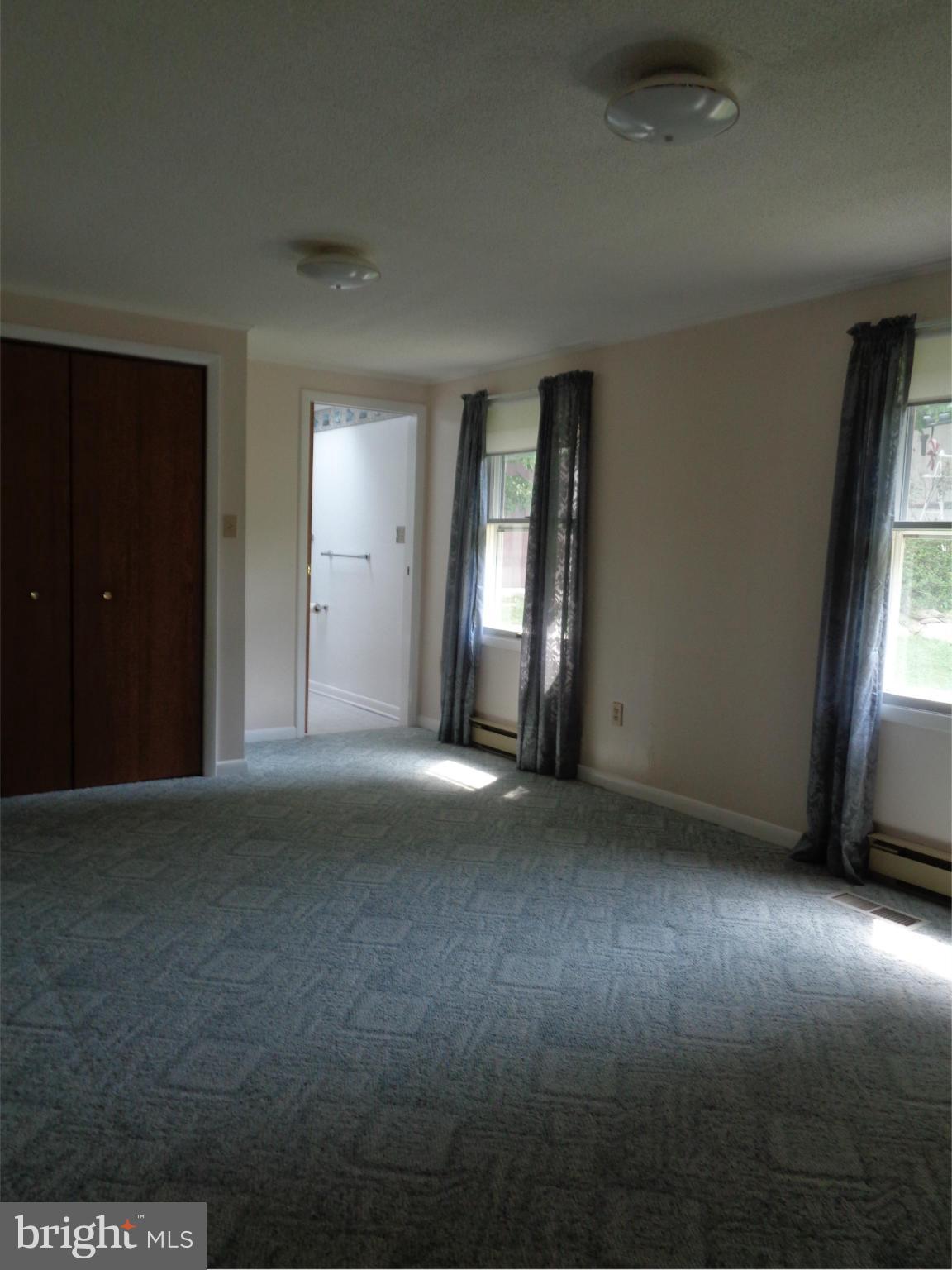 4307 York Road, Unit 1 Manchester, MD 21102 - Photo 25 of 30 an empty room with windows and closet