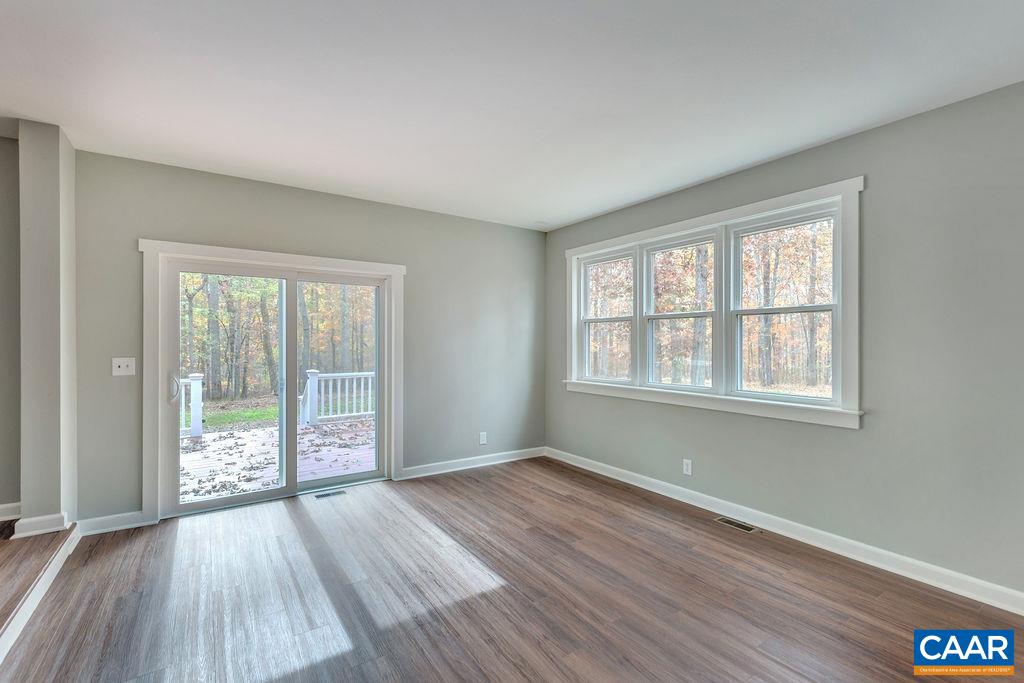 1900 Thunder Ridge Road Afton, VA 22920 - Photo 18 of 49 an empty room with wooden floor and windows