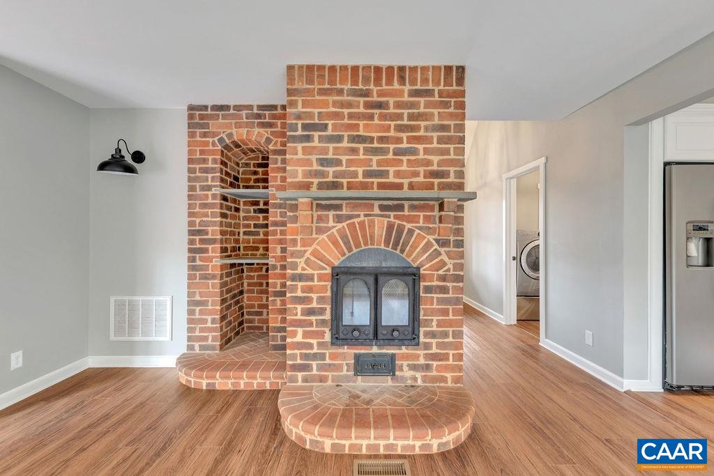 1900 Thunder Ridge Road Afton, VA 22920 - Photo 22 of 49 a view of a hallway with wooden floor and a fireplace