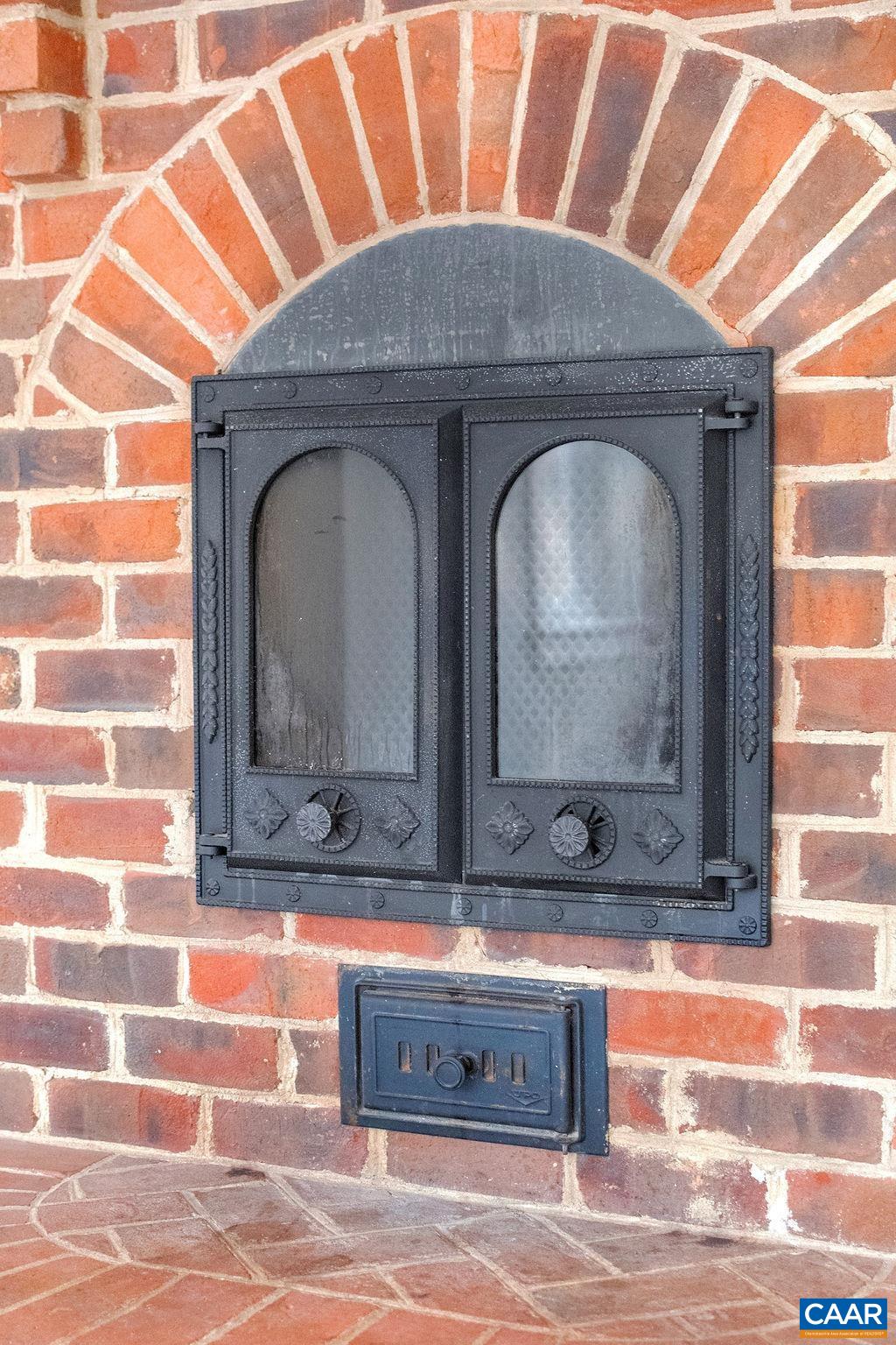 1900 Thunder Ridge Road Afton, VA 22920 - Photo 23 of 49 a closeup of a fireplace and a mirror