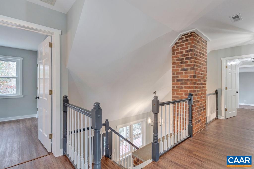 1900 Thunder Ridge Road Afton, VA 22920 - Photo 31 of 49 a view of a hallway with wooden floor and stairs