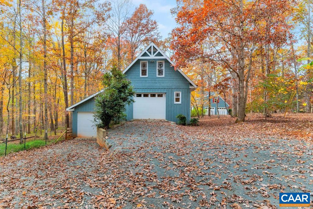 1900 Thunder Ridge Road Afton, VA 22920 - Photo 47 of 49 a front view of a house with a yard and garage