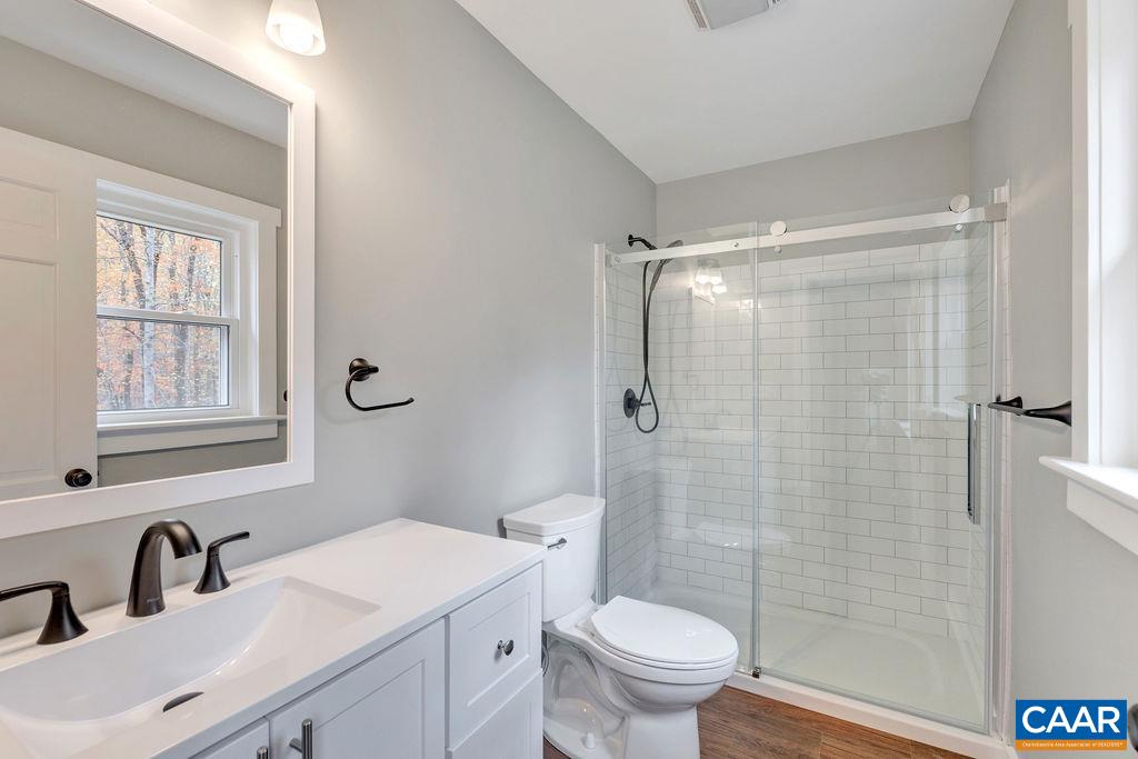 1900 Thunder Ridge Road Afton, VA 22920 - Photo 9 of 49 a bathroom with a sink toilet and shower