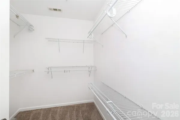a view of an empty walk in closet