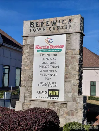 a sign on the side of a brick building
