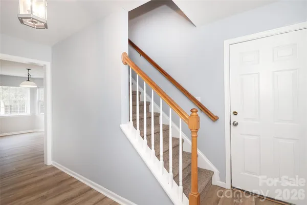 a view of an entryway with wooden floor