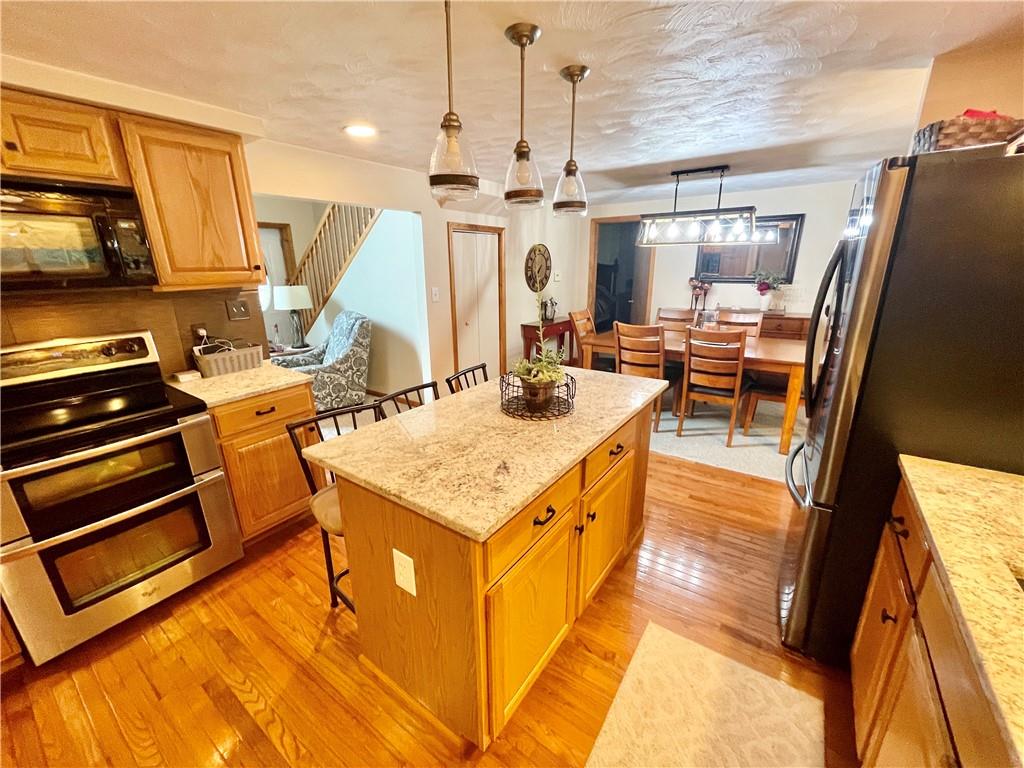 1324 G I Road Spring Church, PA 15686 - Photo 11 of 31 a kitchen with a sink appliances and cabinets