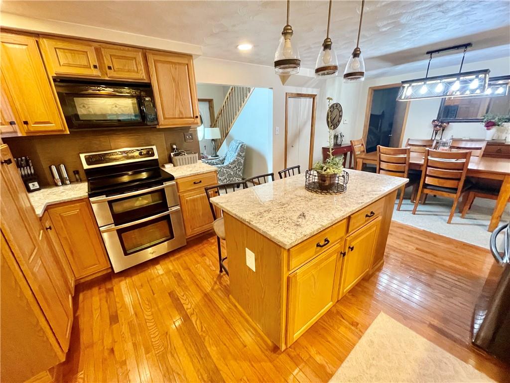 1324 G I Road Spring Church, PA 15686 - Photo 12 of 31 a kitchen with a stove and a kitchen island