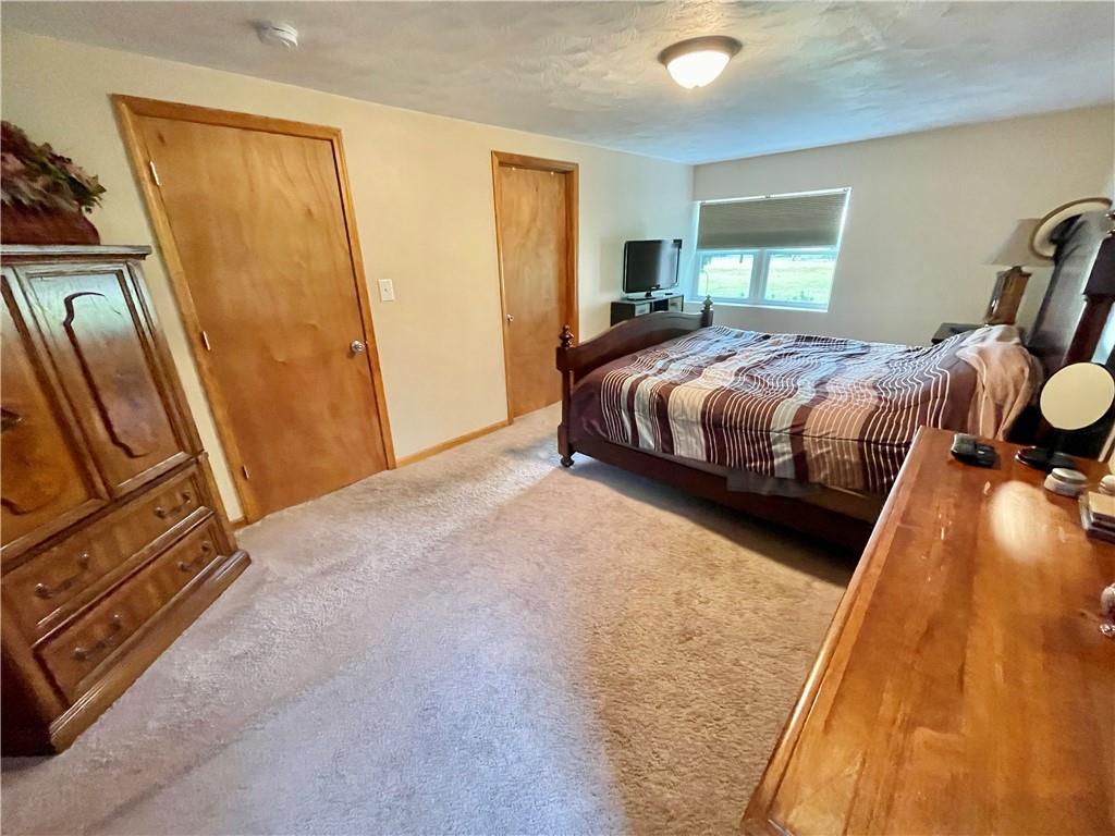 1324 G I Road Spring Church, PA 15686 - Photo 21 of 31 a bedroom with a bed and wooden floor