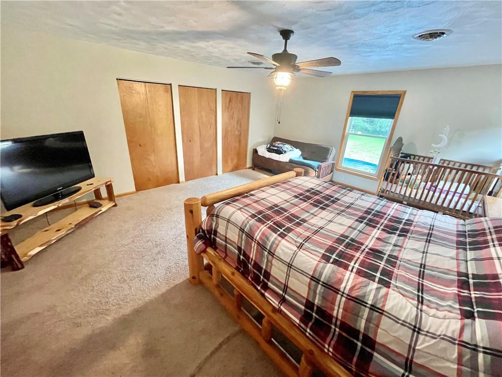 1324 G I Road Spring Church, PA 15686 - Photo 23 of 31 a bedroom with a bed and a flat screen tv