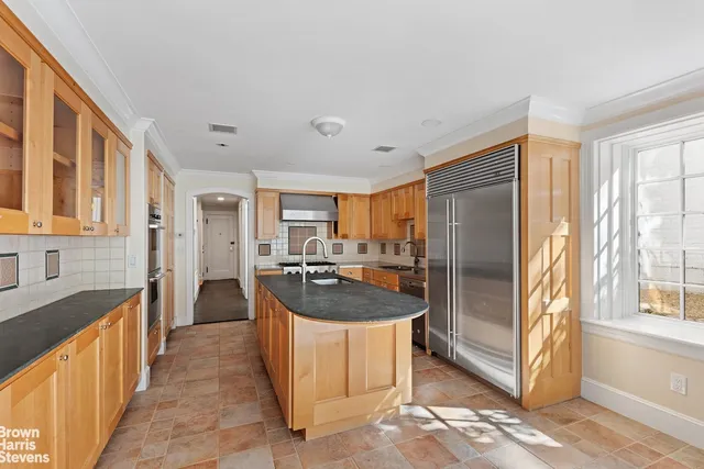 a kitchen with counter top space and stainless steel appliances