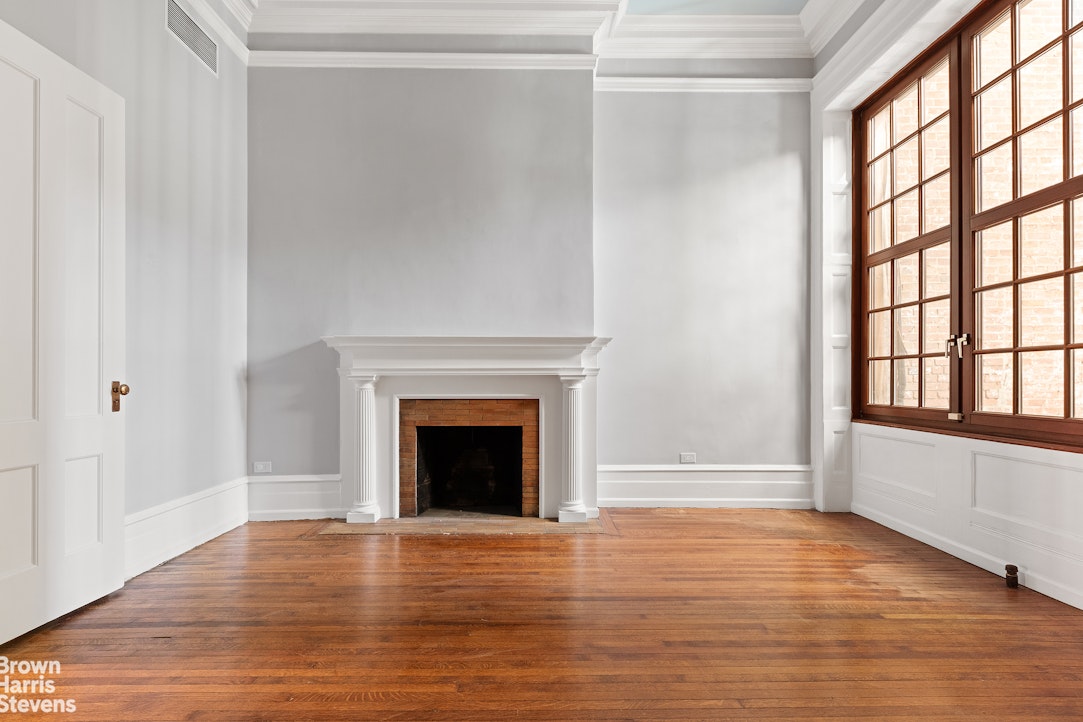 20 West 12th Street Manhattan, NY 10011 - Photo 14 of 30 a view of an empty room with wooden floor and a window