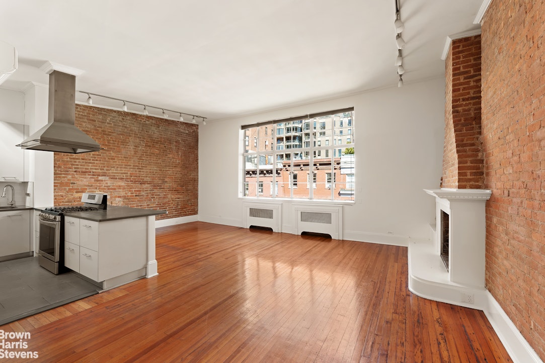 20 West 12th Street Manhattan, NY 10011 - Photo 26 of 30 an empty room with wooden floor and windows