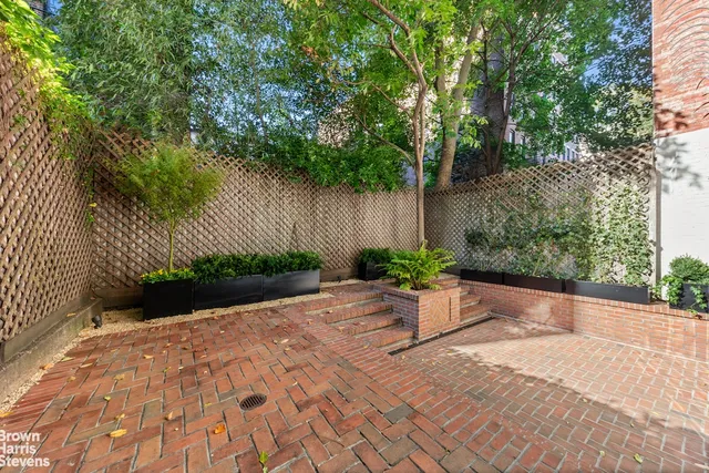 a view of garden with patio