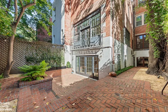 a view of a building with a yard