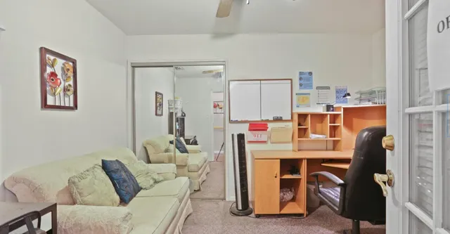 a work place with furniture and window