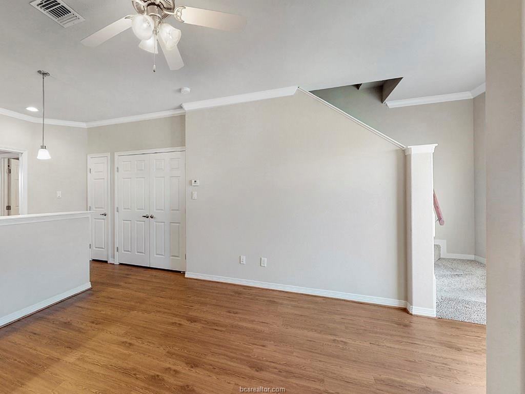 1198 Jones-Butler Road, Unit 2607 College Station, TX 77840 - Photo 5 of 26 a view of an empty room with wooden floor
