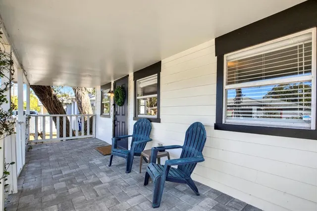 a view of hall way with furniture and stairs