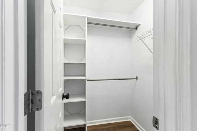 a bed room with a bed and a night lamp