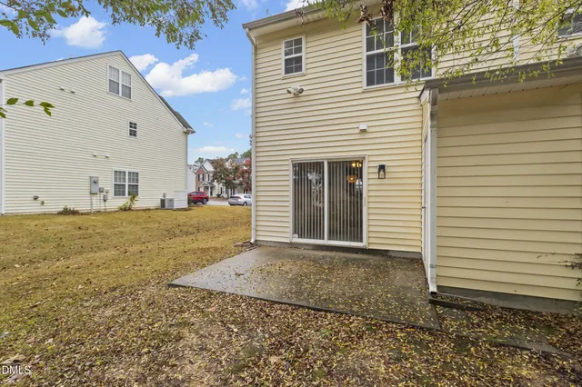 a view of a yard with a tree