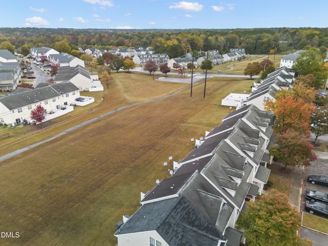 an aerial view of a house with a lake view
