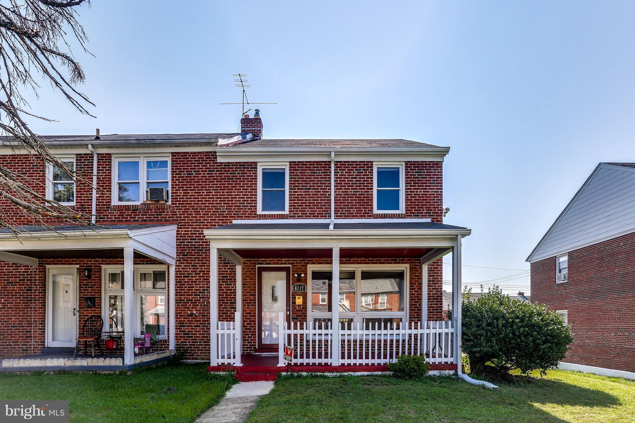 6117 Edlynne Road Baltimore, MD 21239 - Photo 1 of 18 a view of a brick house with a yard