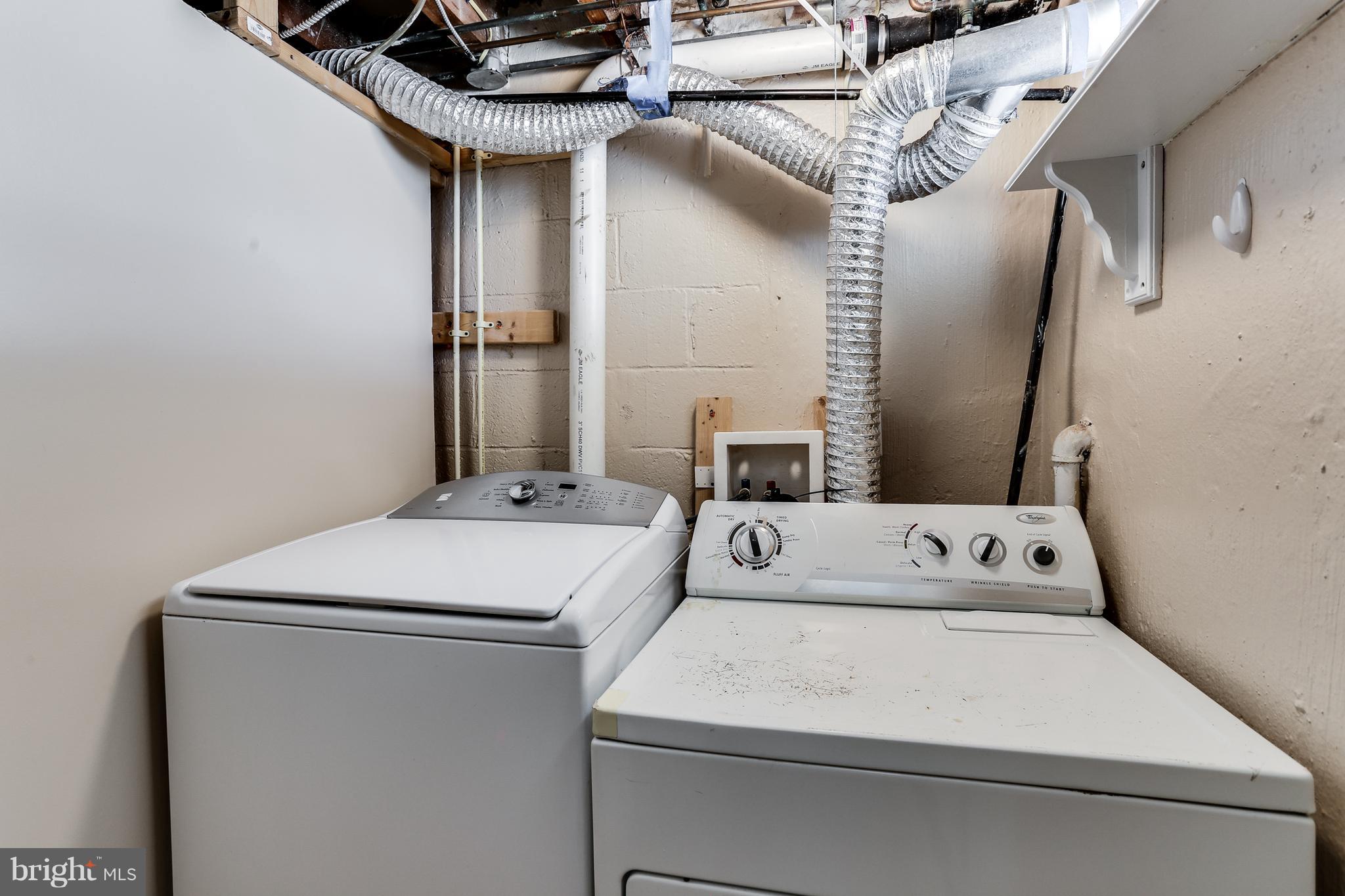 6117 Edlynne Road Baltimore, MD 21239 - Photo 12 of 18 a utility room with dryer and washer