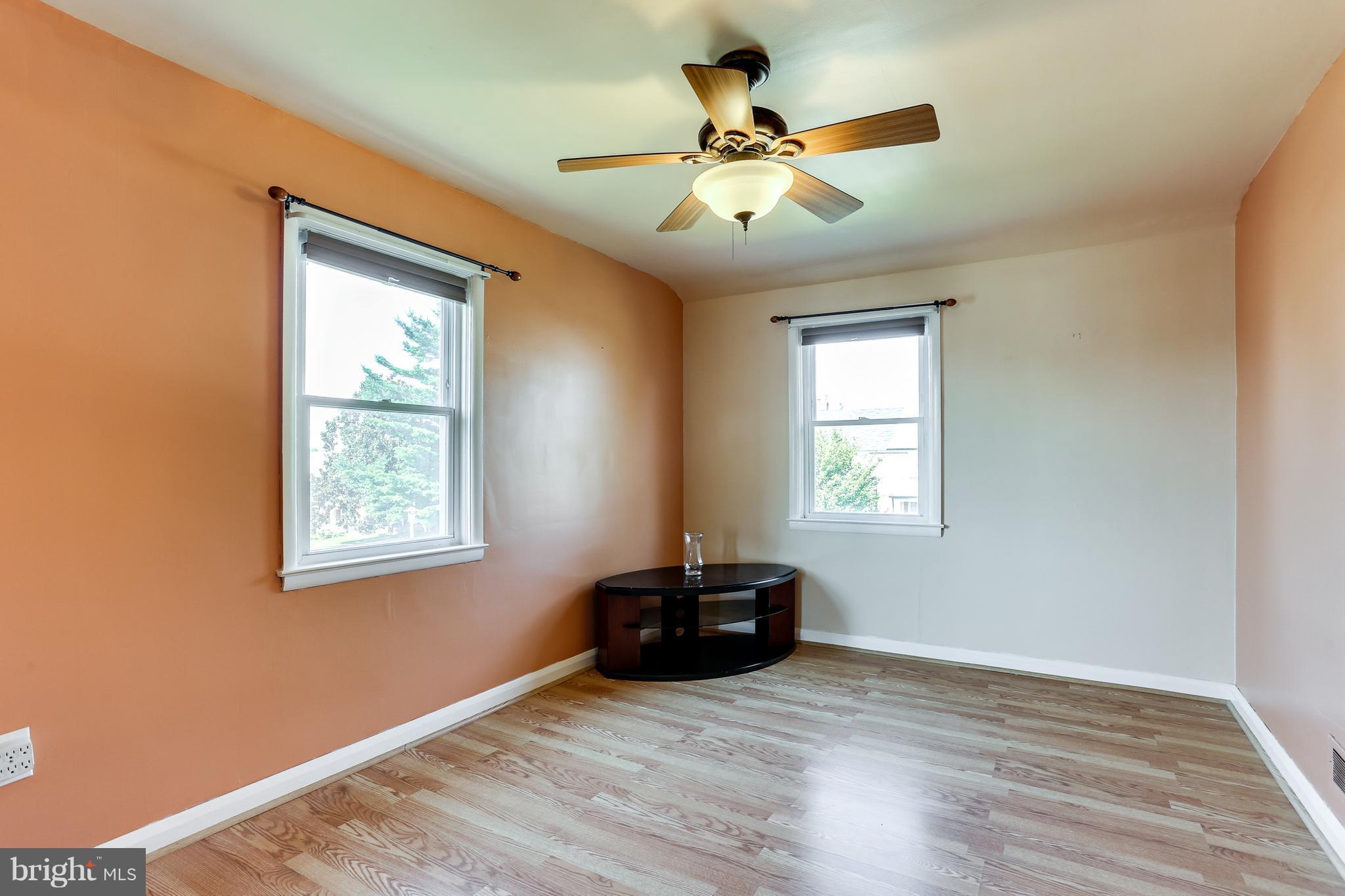 6117 Edlynne Road Baltimore, MD 21239 - Photo 14 of 18 a living room with hardwood floor and window