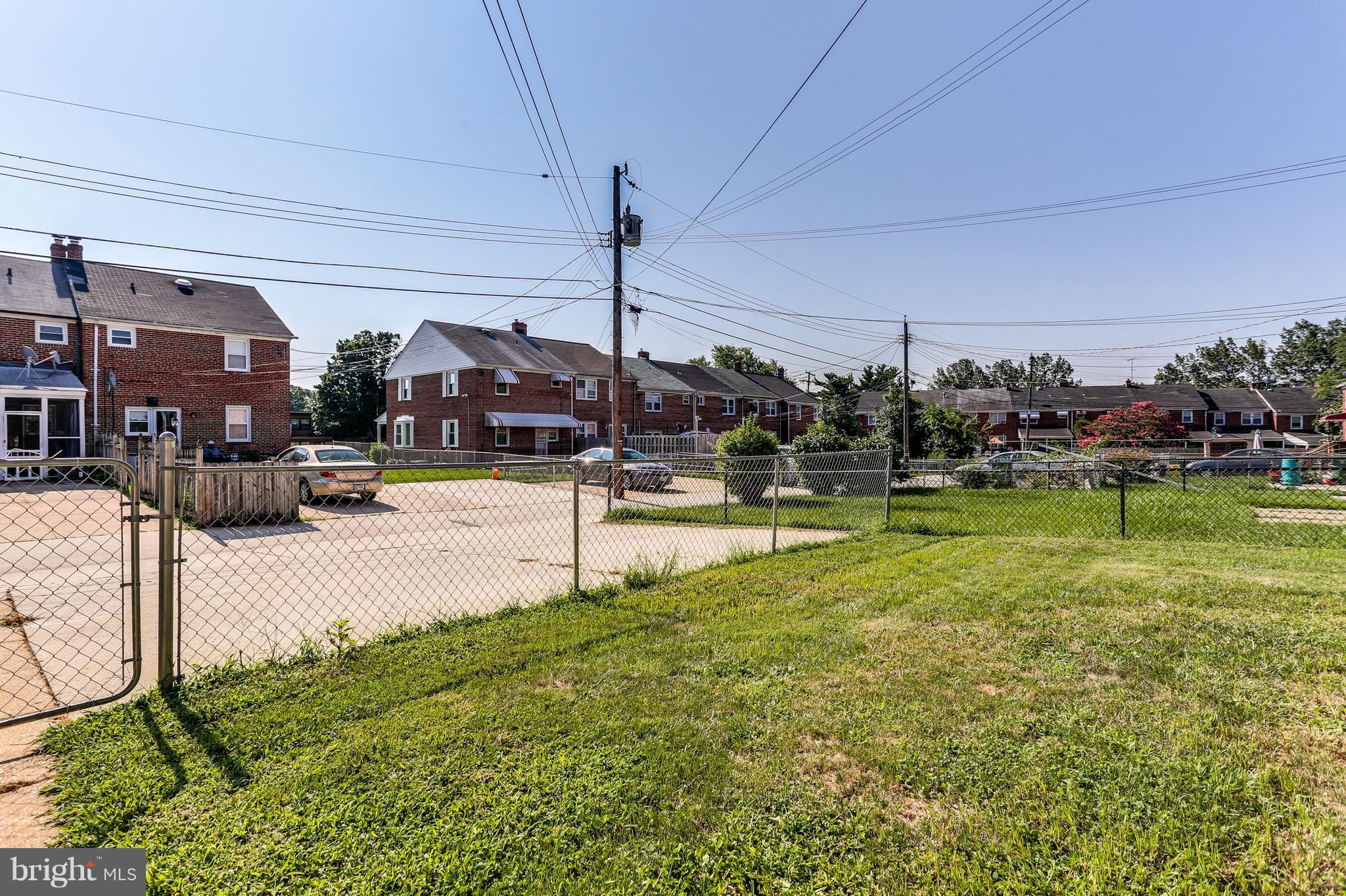 6117 Edlynne Road Baltimore, MD 21239 - Photo 4 of 18 a swimming pool with yard in front of it