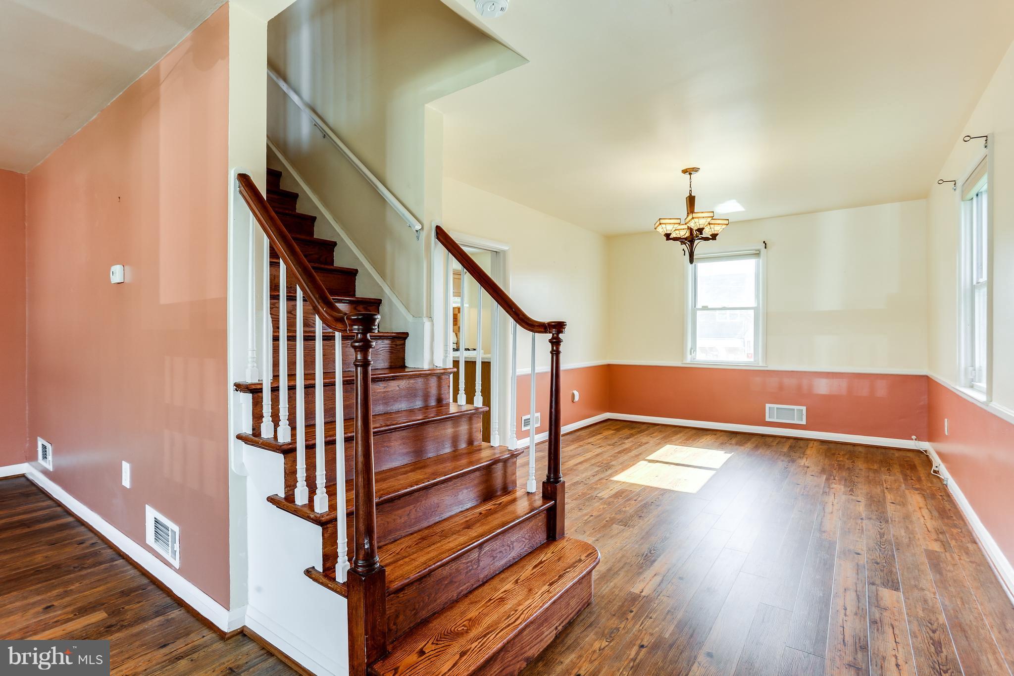 6117 Edlynne Road Baltimore, MD 21239 - Photo 8 of 18 a view of entryway and hall with wooden floor