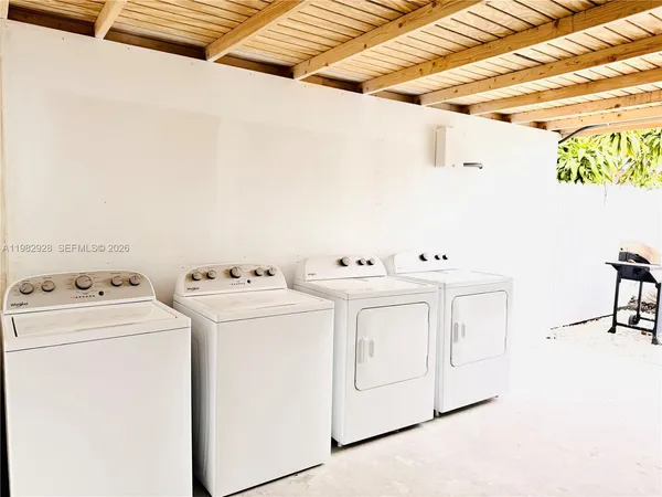 a utility room with dryer and washer