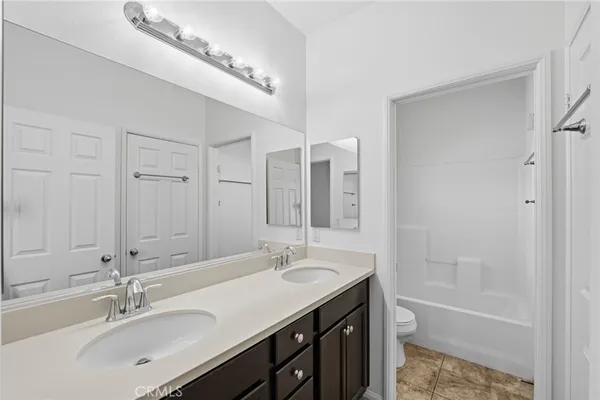 a bathroom with a shower a toilet and a shower