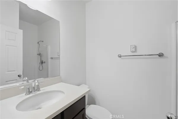 a bathroom with a sink and vanity