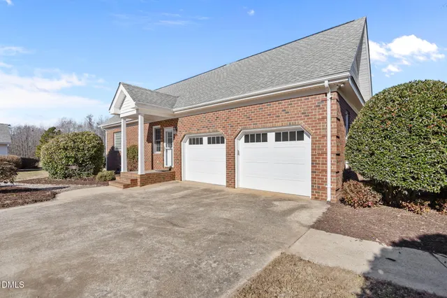 a view of a house with backyard and windows