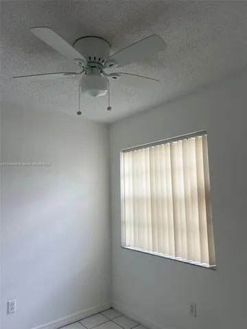 a view of yard with swimming pool and green space