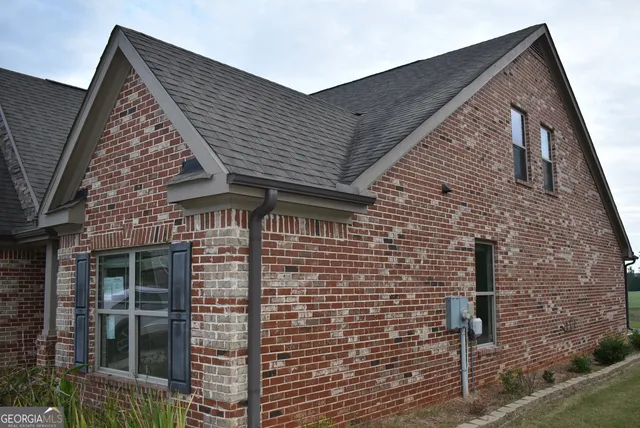 a front view of a house with parking
