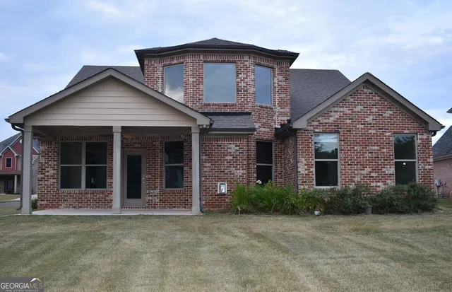 front view of a house with a small yard
