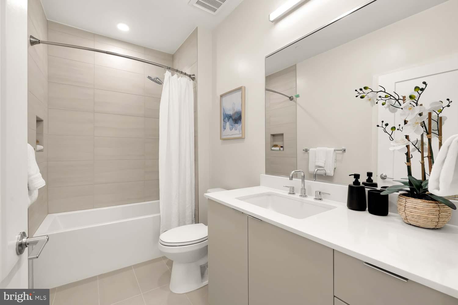 2005 11th Street Northwest, Unit 203 Washington, DC 20001 - Photo 16 of 20 a bathroom with a sink a toilet and shower