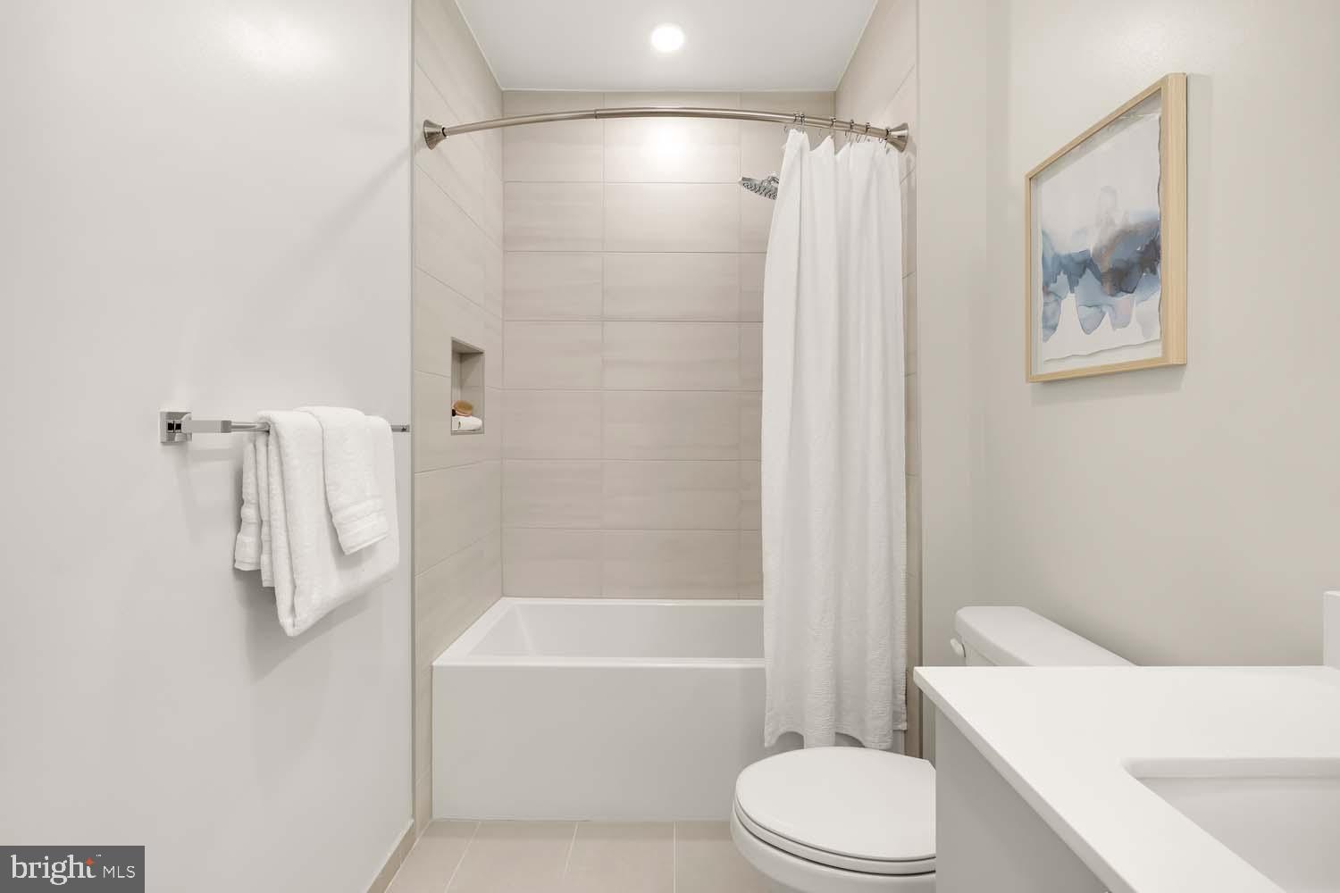2005 11th Street Northwest, Unit 203 Washington, DC 20001 - Photo 17 of 20 a bathroom with a toilet and a bath tub
