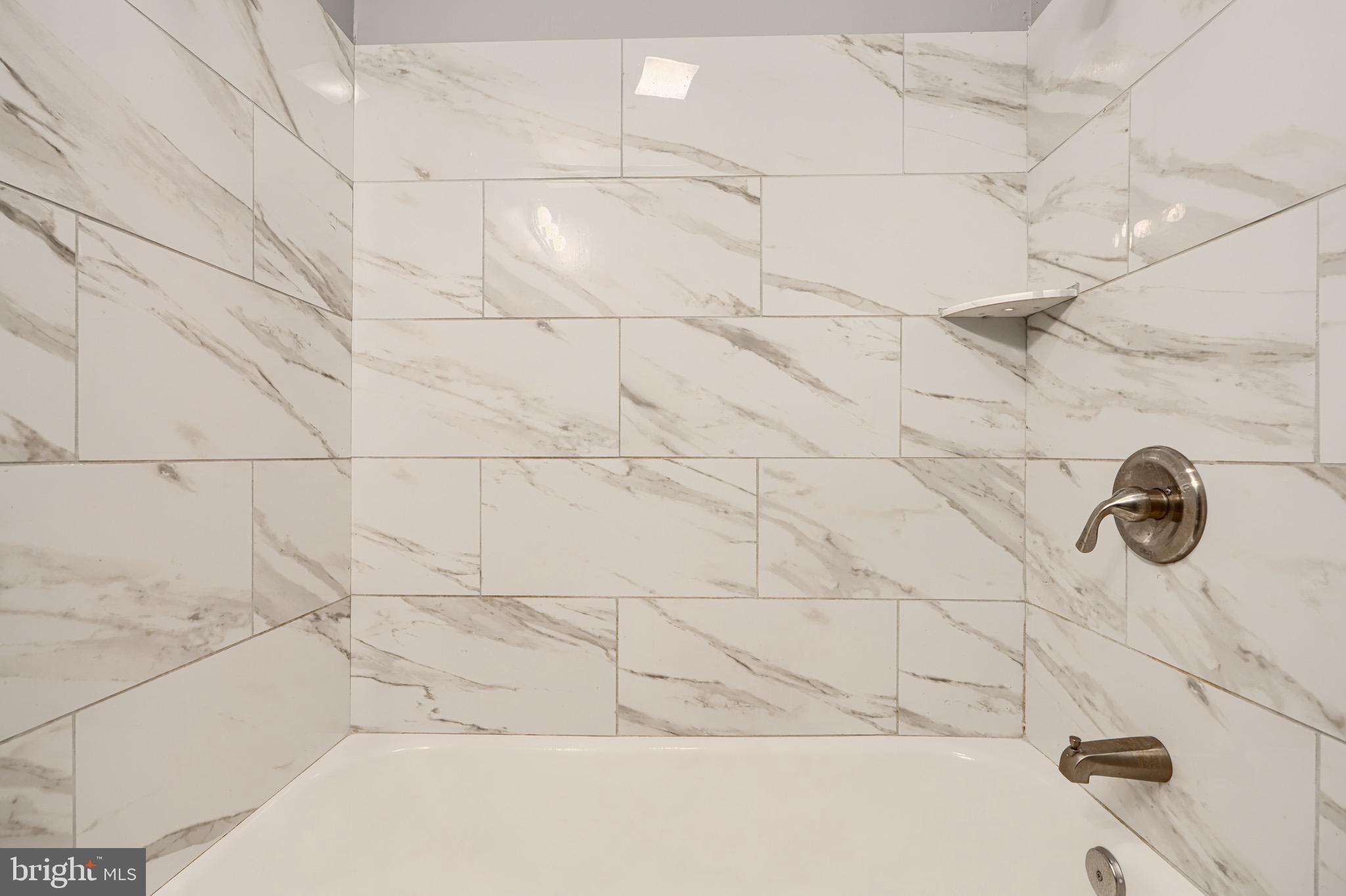 424 North Linwood Avenue Baltimore, MD 21224 - Photo 19 of 28 a bathroom with a bathtub