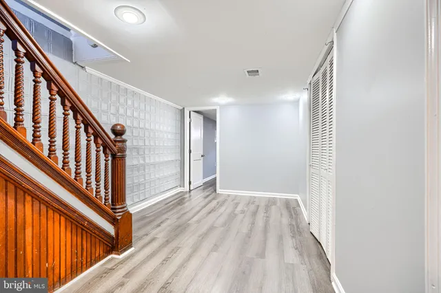a view of an entryway with wooden floor