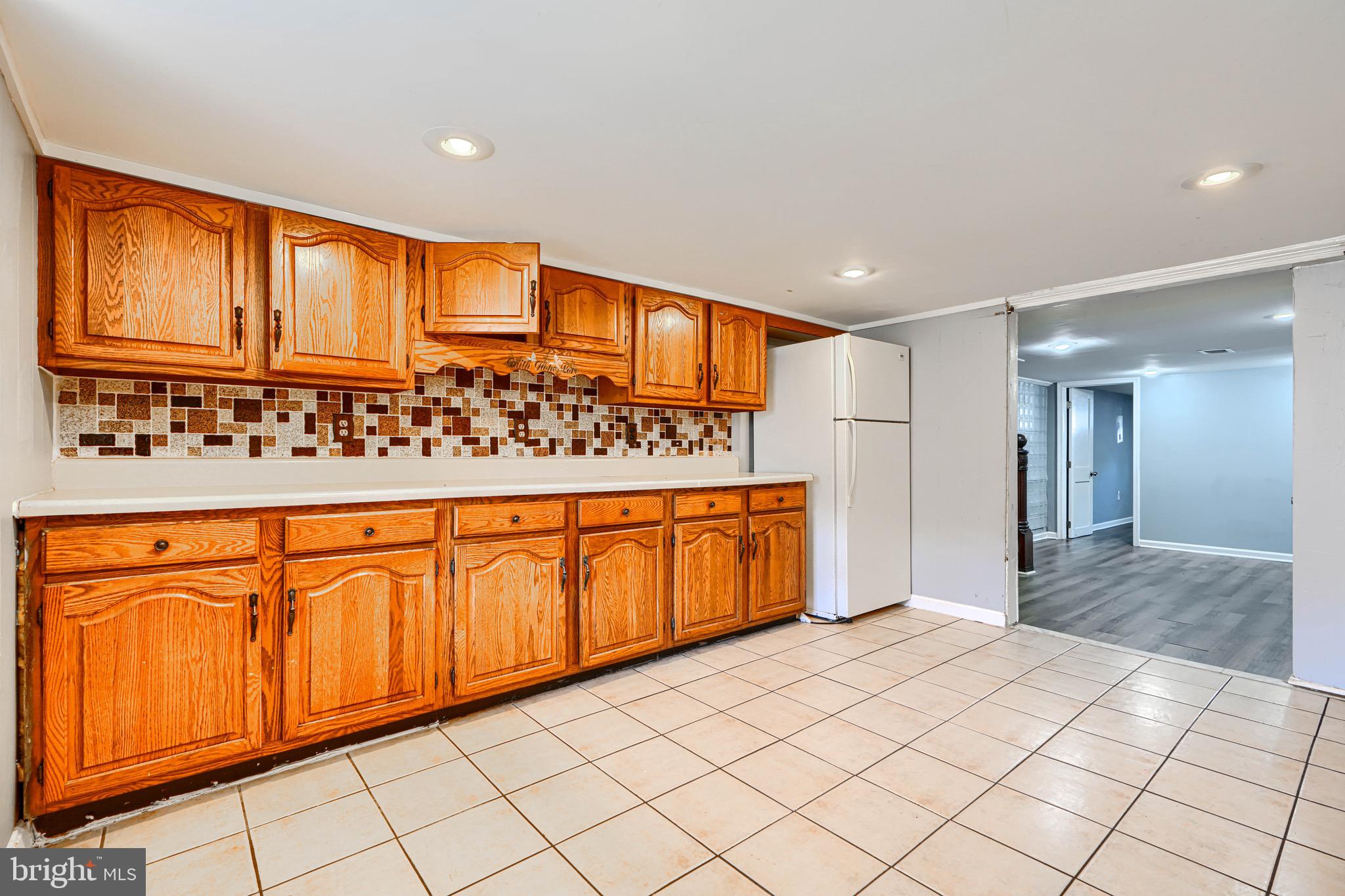424 North Linwood Avenue Baltimore, MD 21224 - Photo 26 of 28 a view of a kitchen with stainless steel appliances granite countertop a refrigerator and cabinets