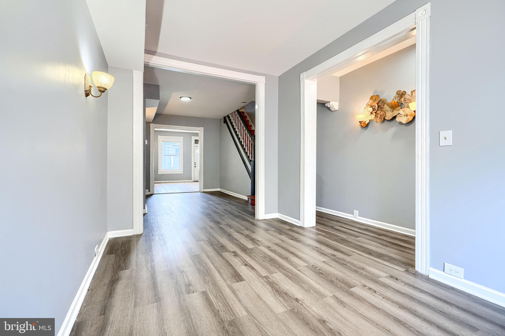 424 North Linwood Avenue Baltimore, MD 21224 - Photo 3 of 28 wooden floor in a hall with a window