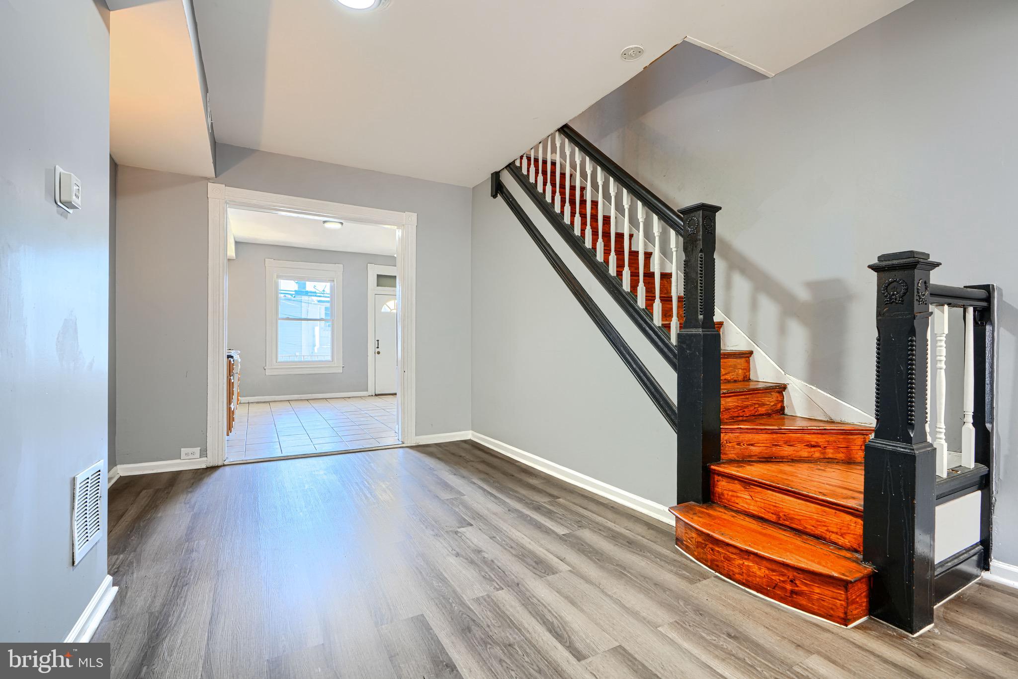 424 North Linwood Avenue Baltimore, MD 21224 - Photo 5 of 28 a view of entryway and hall with wooden floor