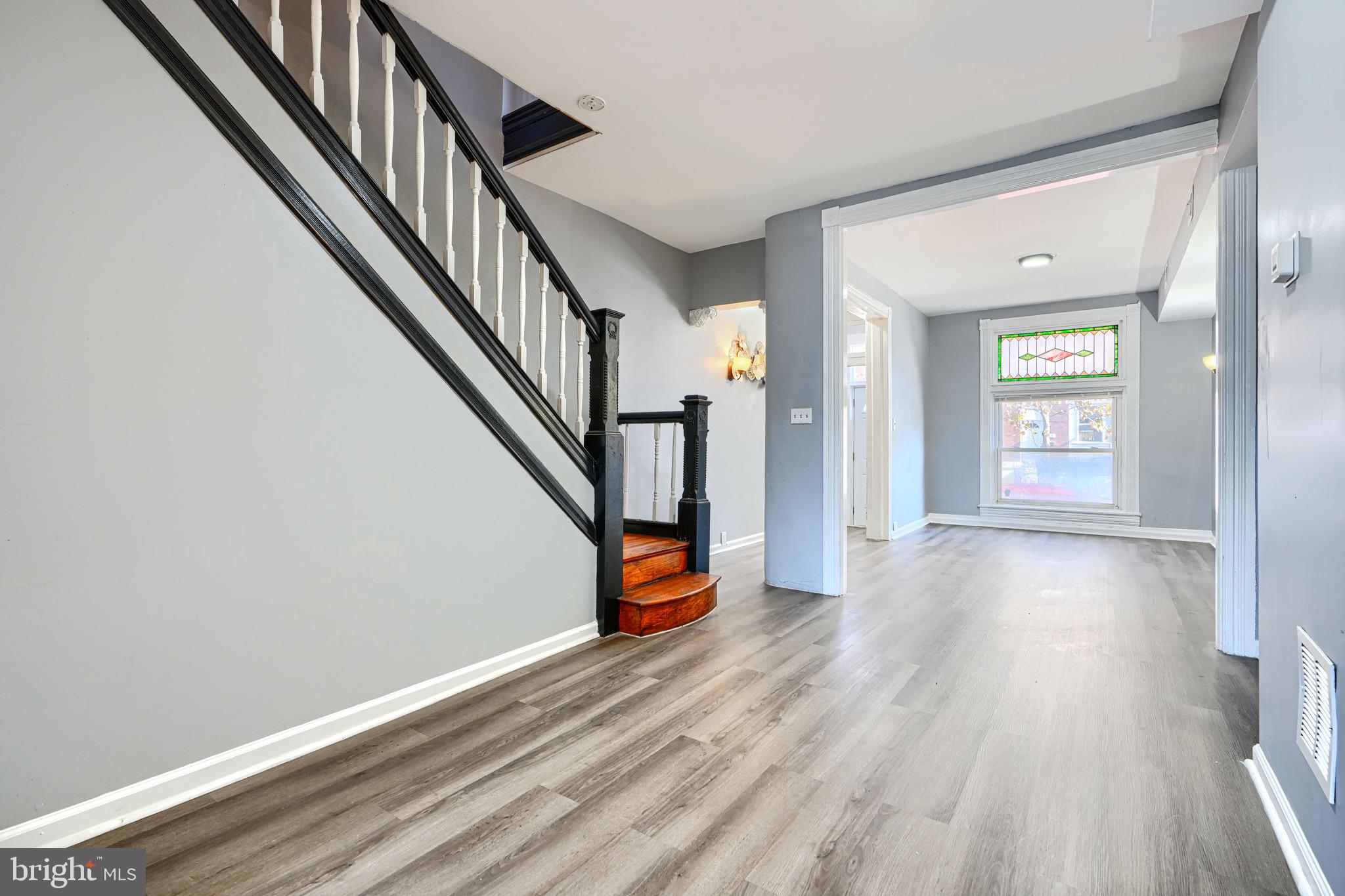 424 North Linwood Avenue Baltimore, MD 21224 - Photo 6 of 28 a view of an entryway with wooden floor and stairs