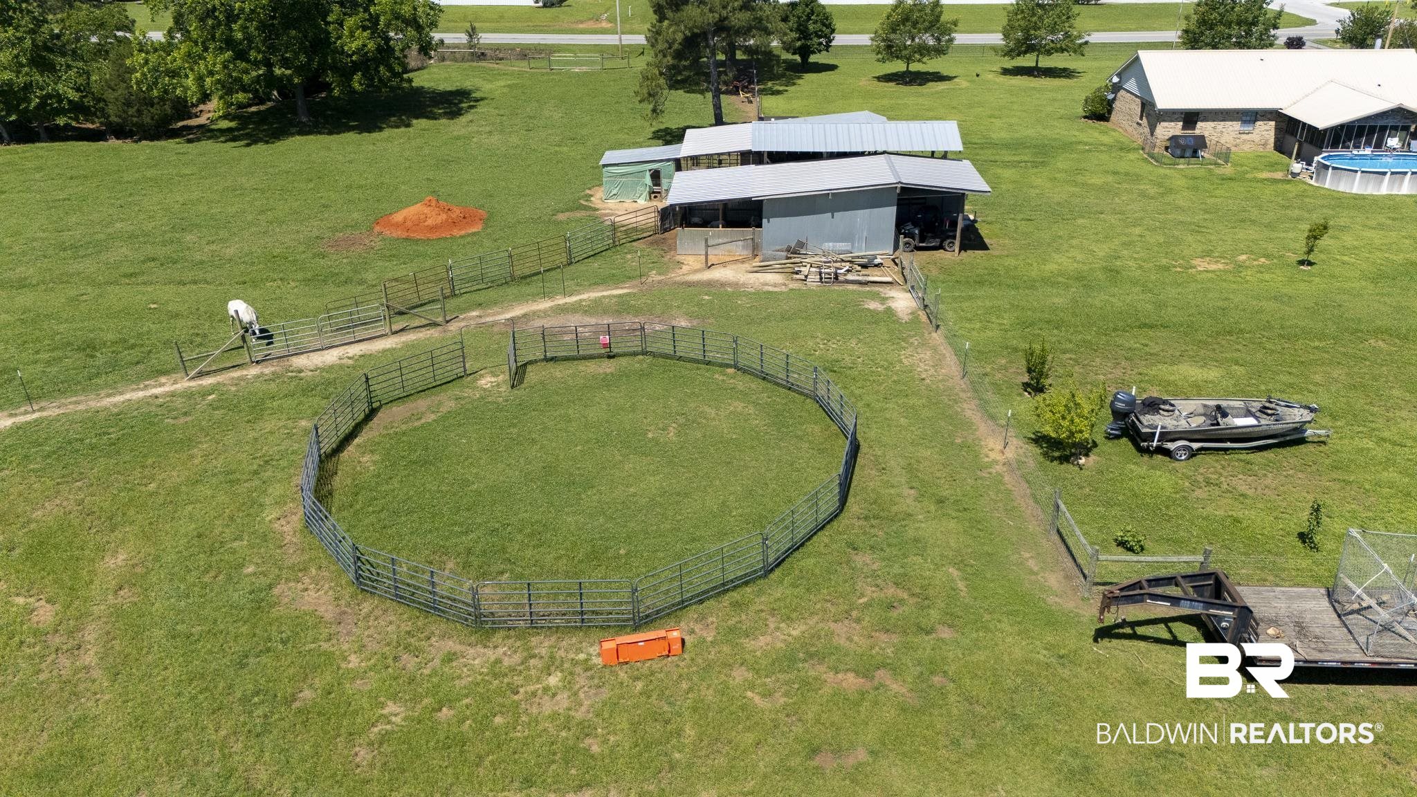 30580 County Road 49 Loxley, AL 36551 - Photo 22 of 32 Expansive green pastureland featuring a livestock corral.