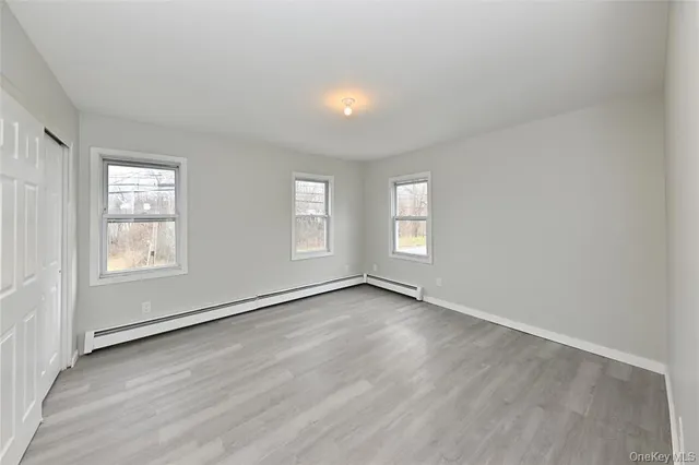 a view of a bathroom with a bathtub and a shower
