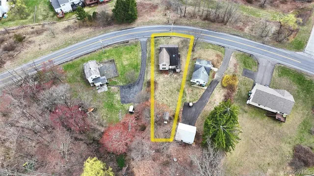 a view of a swimming pool with a yard and mountain view